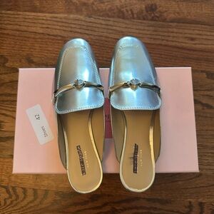 kate spade Metallic Silver Slip-On Mules with Gold Tone Bit
